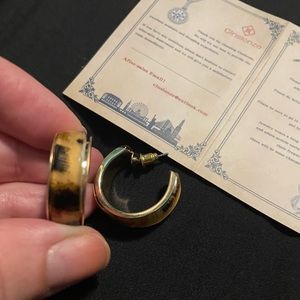 Acrylic leopard print earrings with gold colored trim